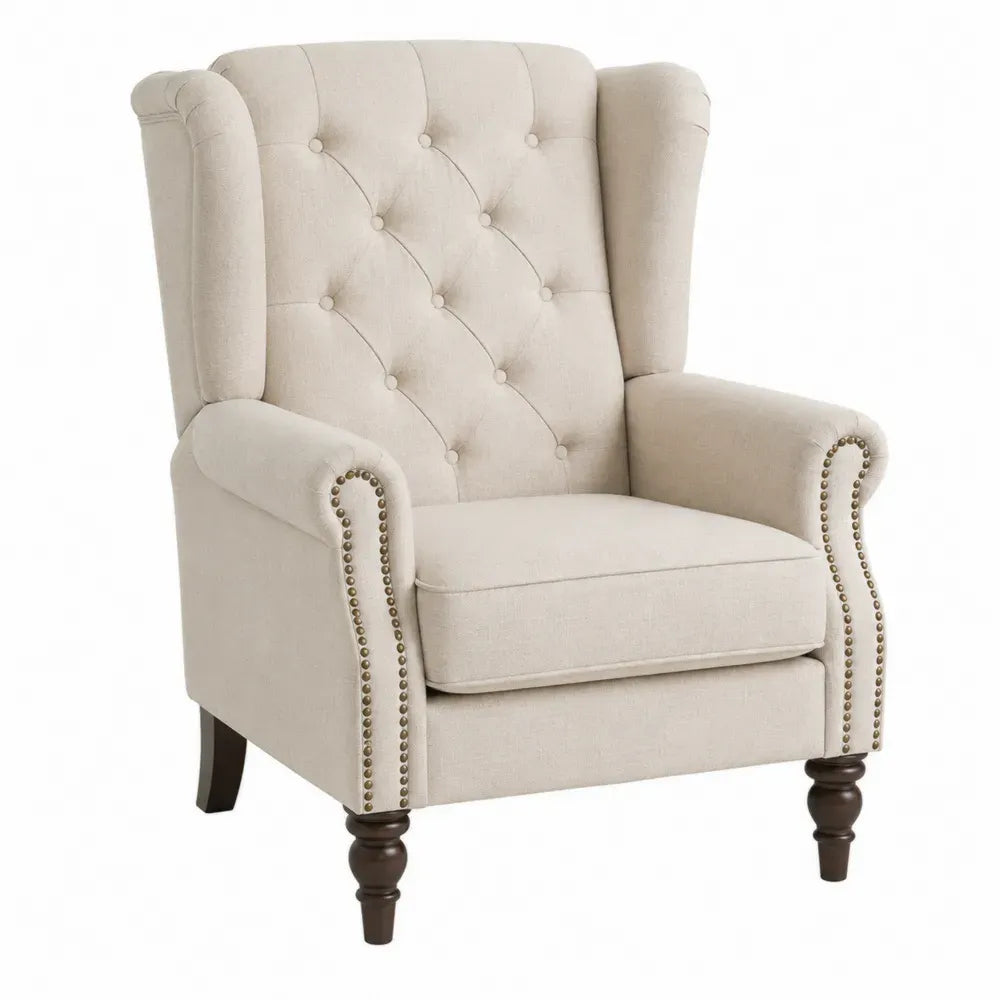 Sillón orejero tapizado beige con respaldo capitoné reposabrazos enrollados tachuelas metálicas y patas de madera marrón 77 x 80 x 102 cm